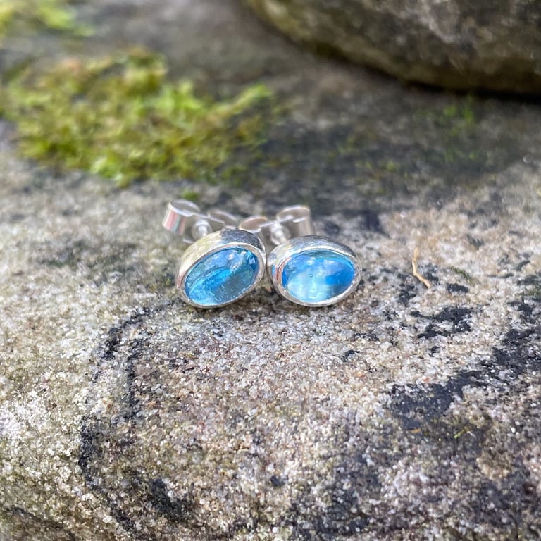 Blue topaz and silver oval stud earrings