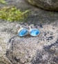 Blue topaz and silver oval stud earrings