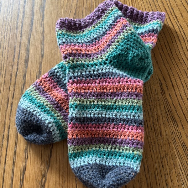A pair of crochet warm and colourful stripy ankle socks in UK size 5-6