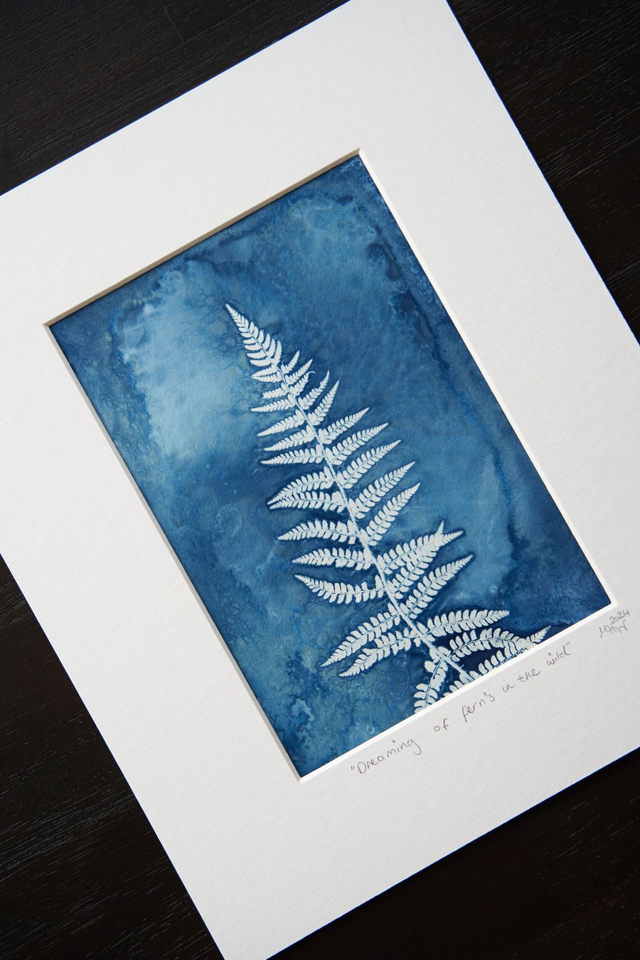original wet cyanotype print entitled "dreaming of ferns in the wild", mounted