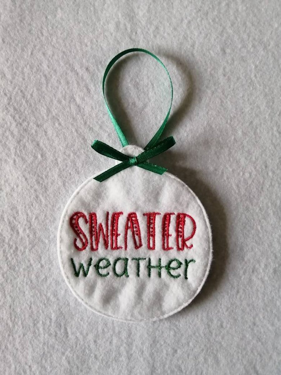 735. Sweater weather Christmas tree hanging ornament.