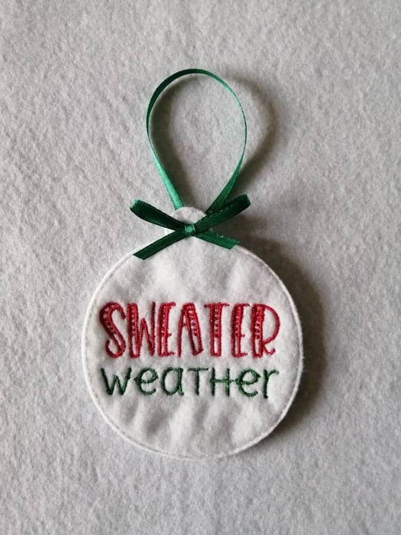 735. Sweater weather Christmas tree hanging ornament.