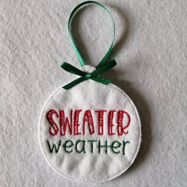 735. Sweater weather Christmas tree hanging ornament.