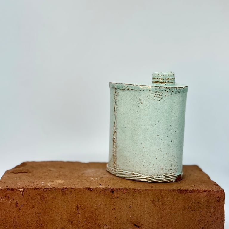 Hand built blue-green bud vase. No 1