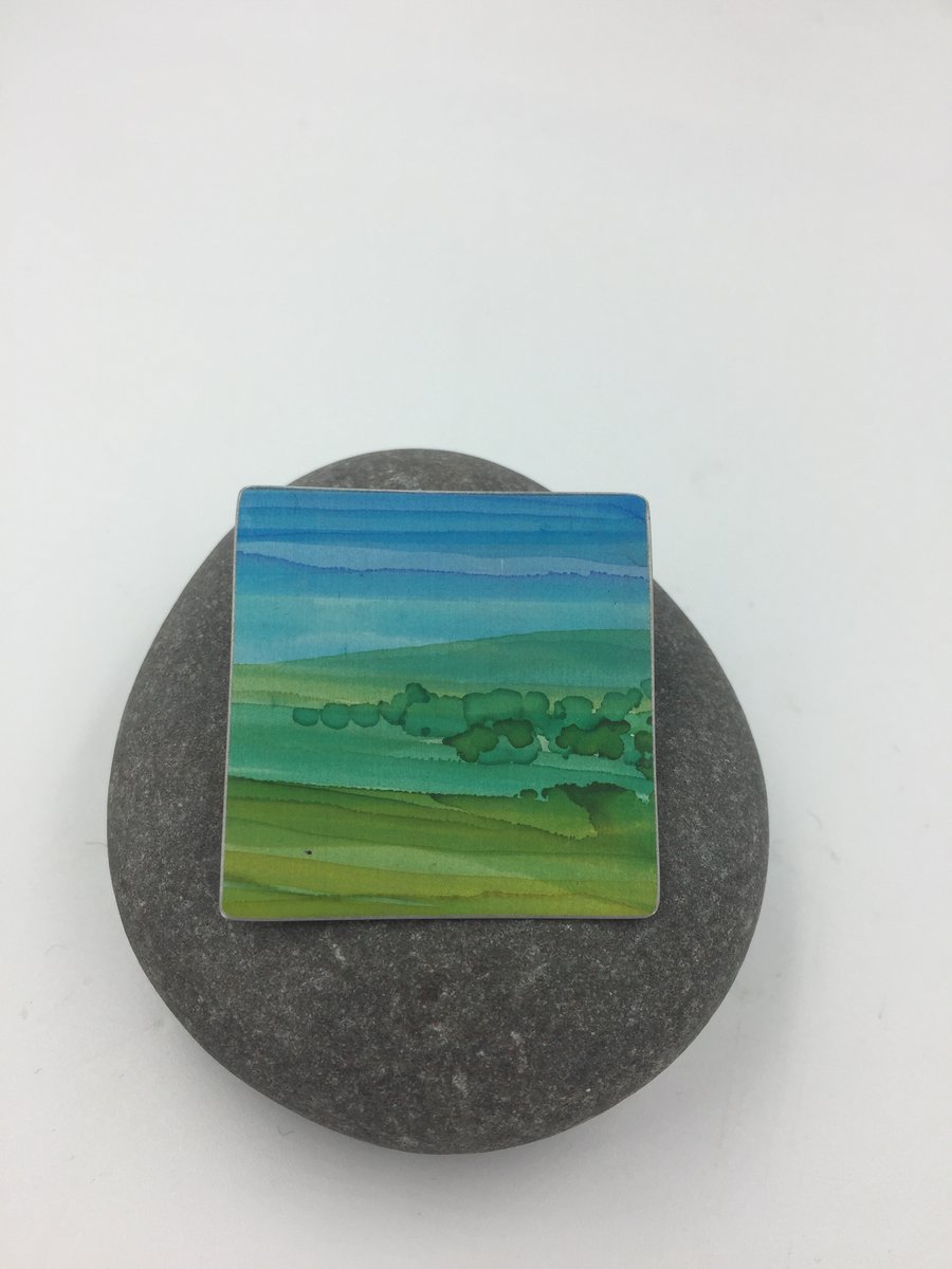 Hand painted anodised aluminium landscape brooch 