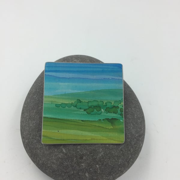 Hand painted anodised aluminium landscape brooch 