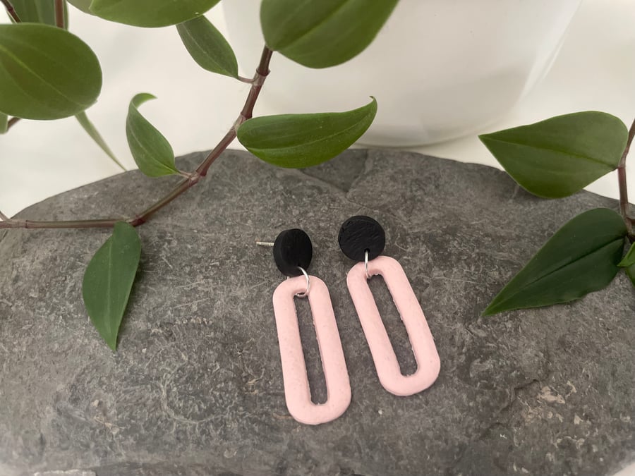 Statement earrings in pale pink and black 