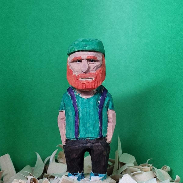Hand carved wooden figure Mac the school caretaker.