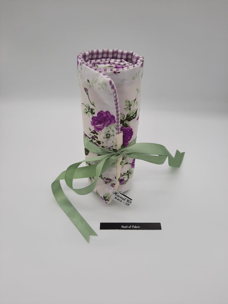 Make up wrap,  white and purple floral, green polkadot lining.