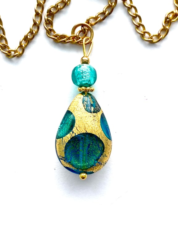 Murano glass gold and green pear drop pendant with gold chain.