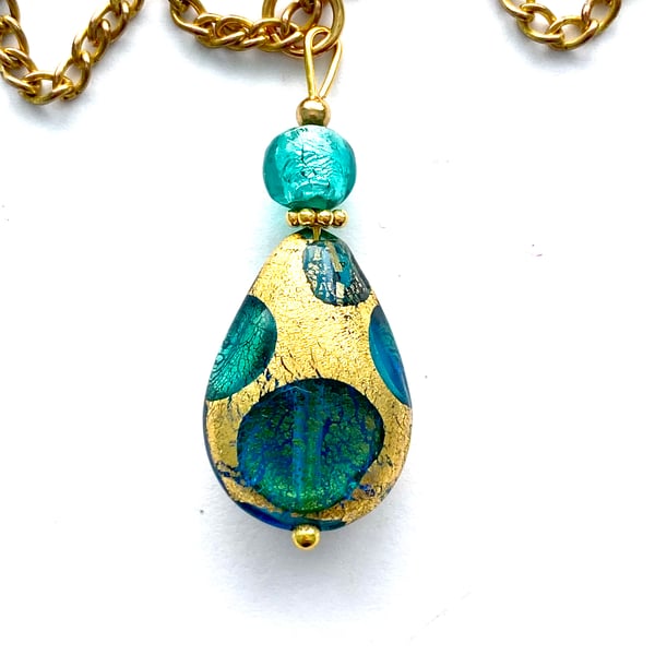 Murano glass gold and green pear drop pendant with gold chain.