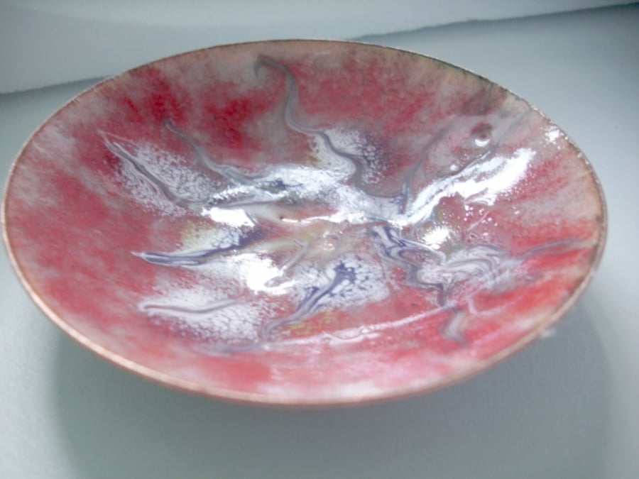 Enamel dish -scrolled gold, white and blue on red over clear enamel