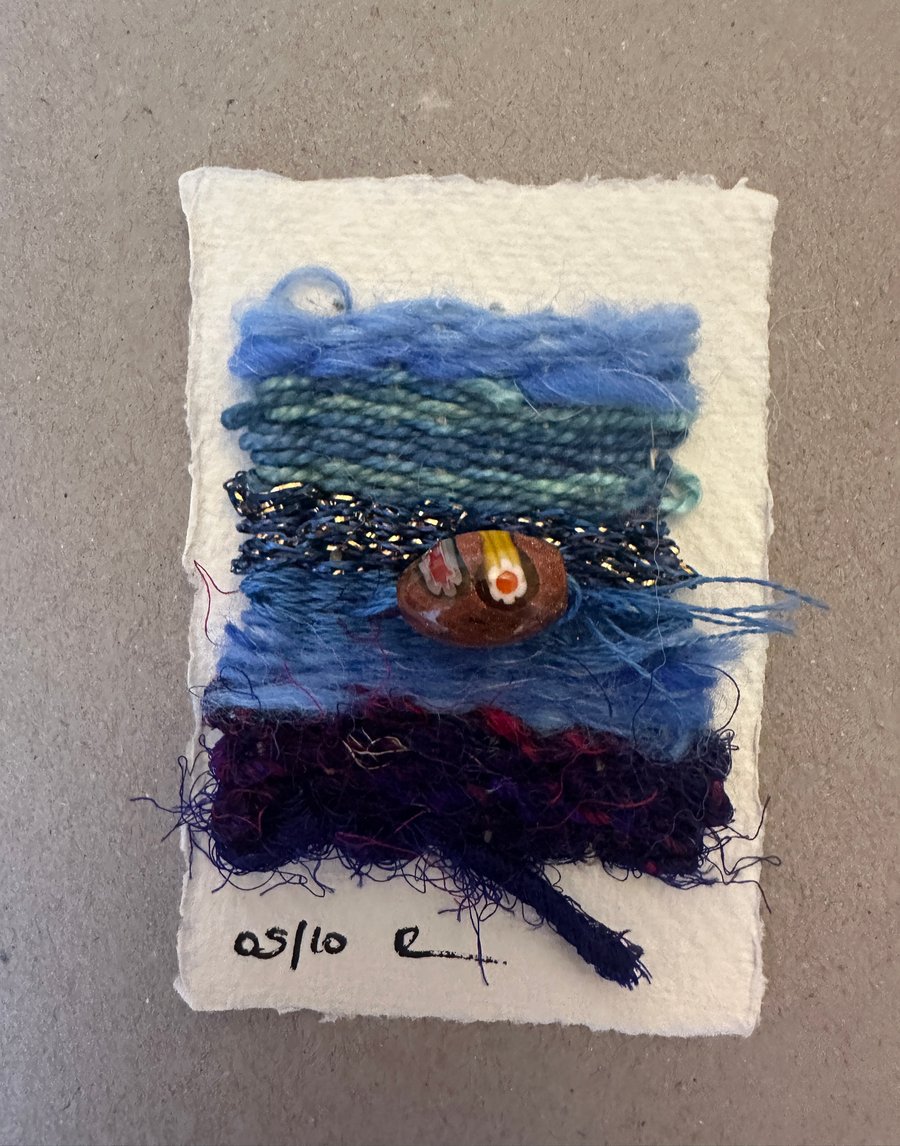 Beaded miniature weaving on card 5 of 10