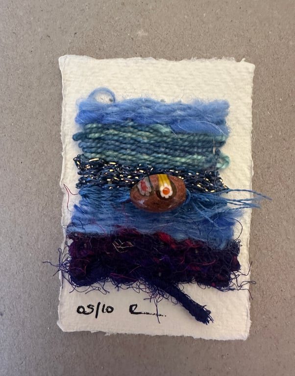 Beaded miniature weaving on card 5 of 10