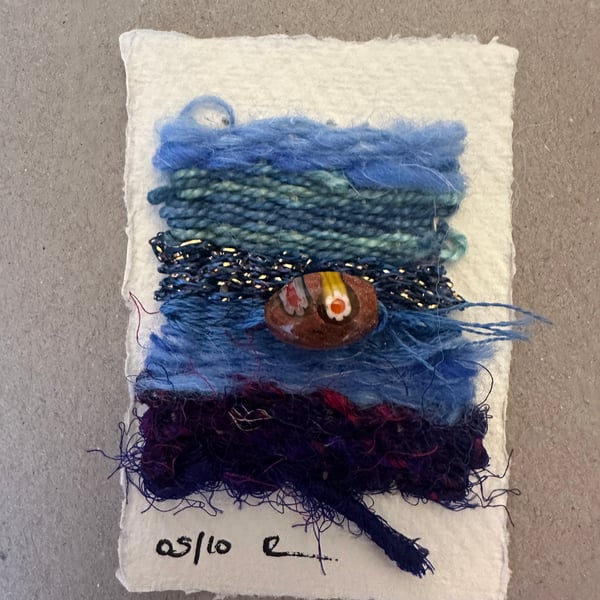 Beaded miniature weaving on card 5 of 10