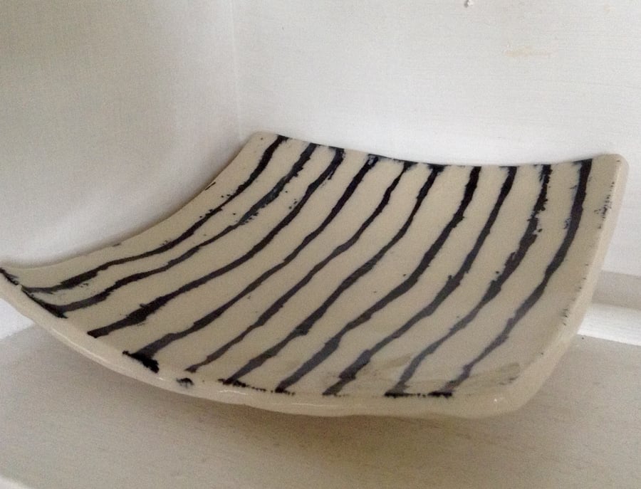 Plate in pottery stoneware with black abstract design 