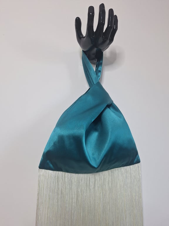 Teal green satin Japanese knot bag with 30cm cream tassel fringe.
