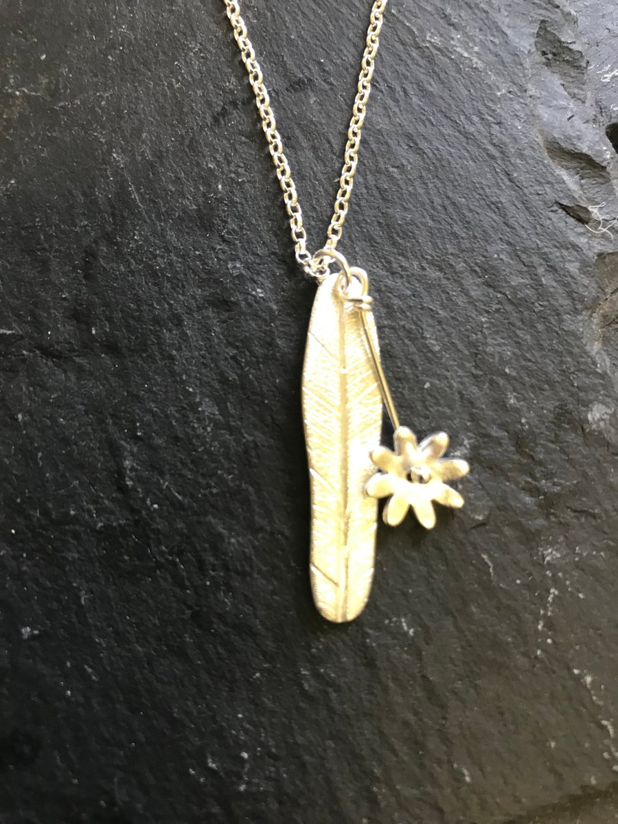 Flower on leaf silver pendant necklace