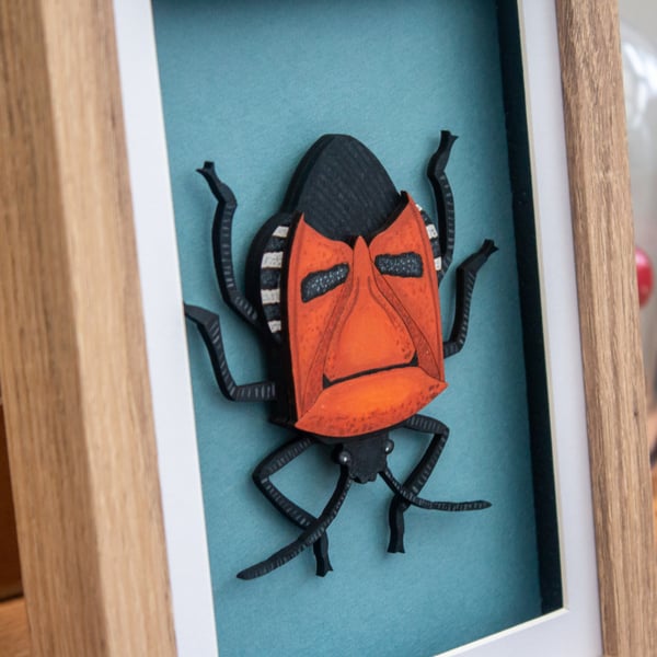 Man-Faced Stink Bug – Layered Wooden Artwork