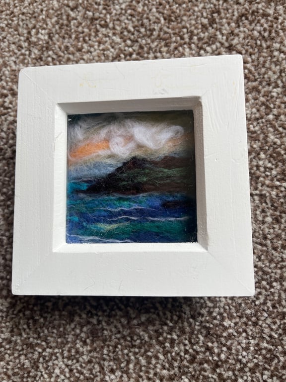 Orange Sunset over cliffs and sea needle felt  white box frame 
