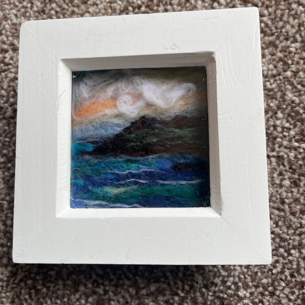 Orange Sunset over cliffs and sea needle felt  white box frame 