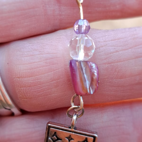 Tarot 'The Star' pendant on a purple rope necklace