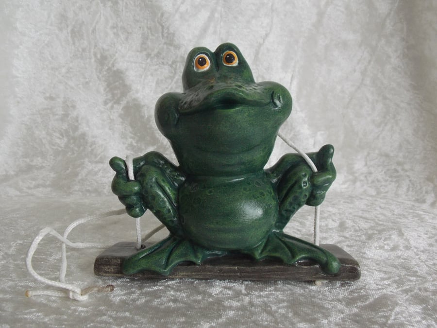 Ceramic Hand Painted Novelty Green Frog Toad On A Swing Garden Hanging Ornament.