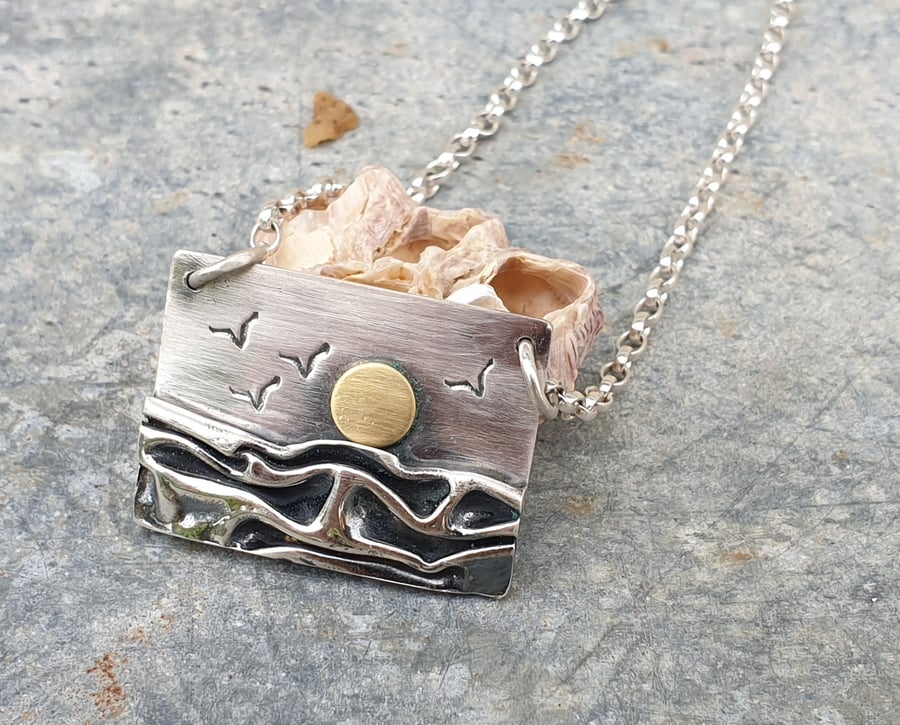 Silver beach, sea coast pendant, with sun and seagulls