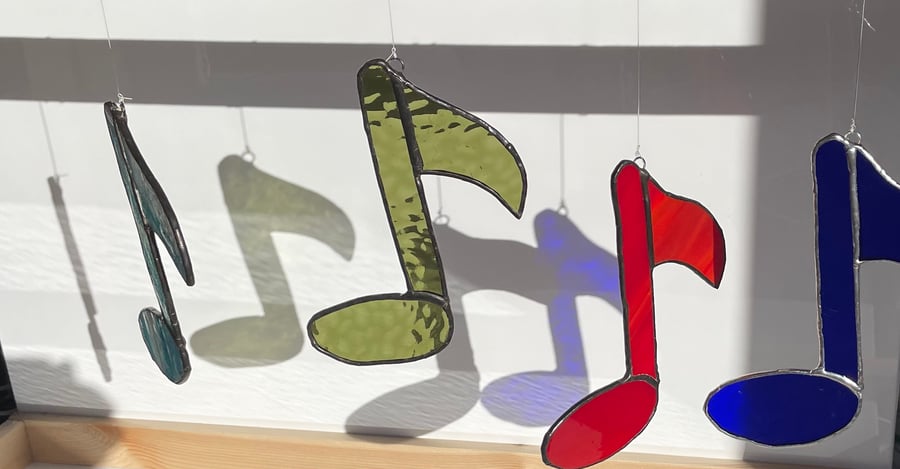 Stained glass musical note hanging suncatcher