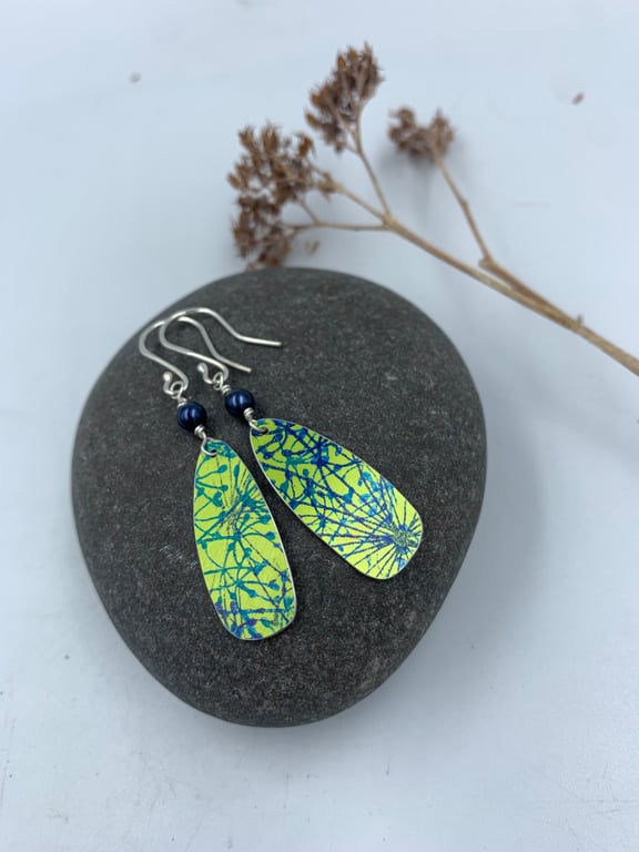 Lime green aluminium cow parsley drop earrings with blue bead