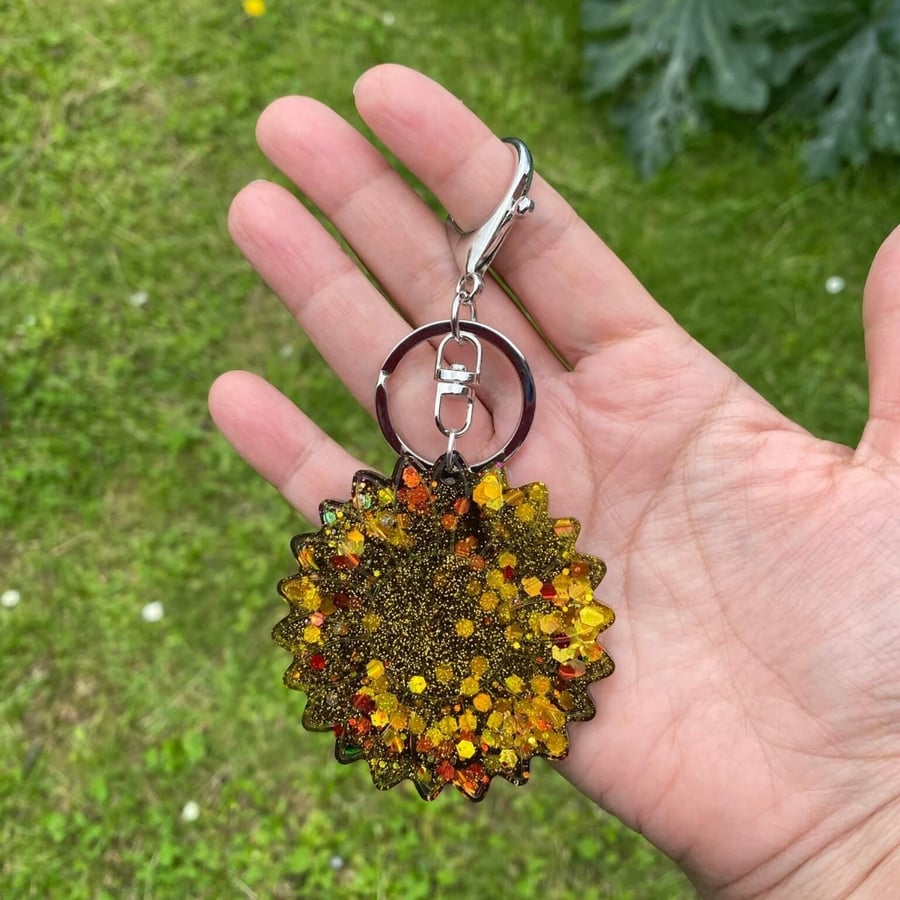Black and yellow sparkly sunflower keyring with large clasp.