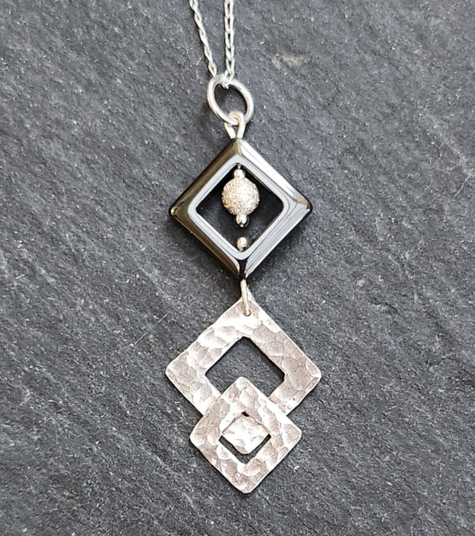 Double diamond sterling silver shapes with haematite pendant