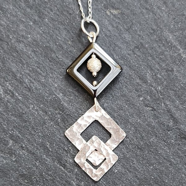 Double diamond sterling silver shapes with haematite pendant