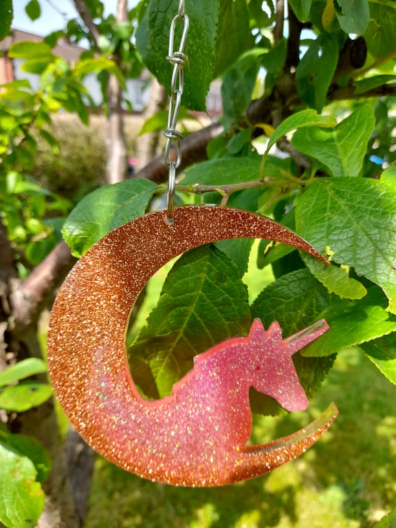 Hand cast Unicorn suncatcher hanging decoration in orange and pink
