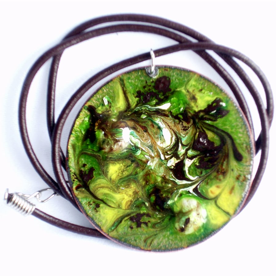 pendant: round - scrolled brown and white on green over clear