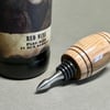 Wood turned walnut and stainless steel bottle stopper