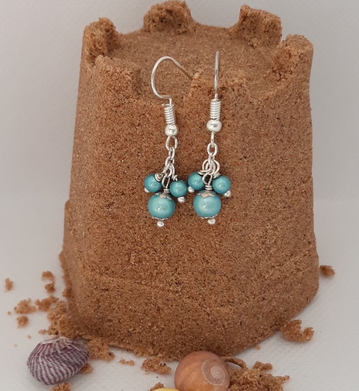 ER07 Pale blue miracle bead drops