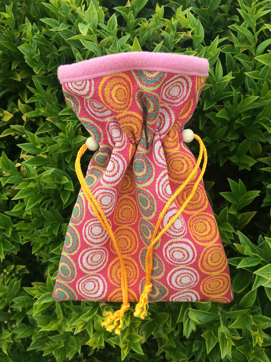 Small bright and colourful jacquard drawstring bag.