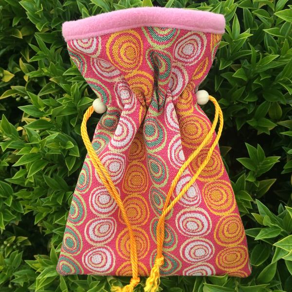 Small bright and colourful jacquard drawstring bag.