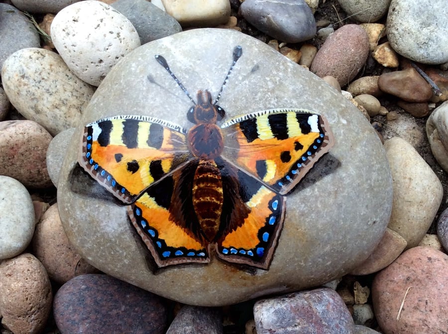 Butterfly hand painted on smooth stone