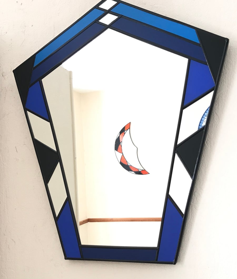 Art Deco style colored mirror in blue and black.Ideal for all situations.