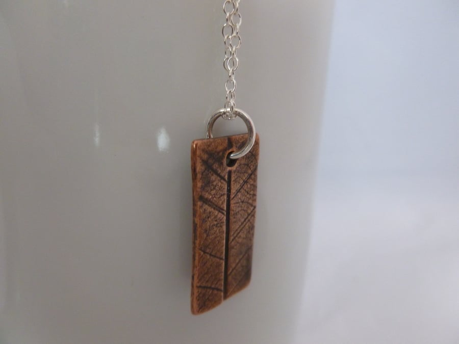 Copper Clay Bar Pendant With Leaf Pattern