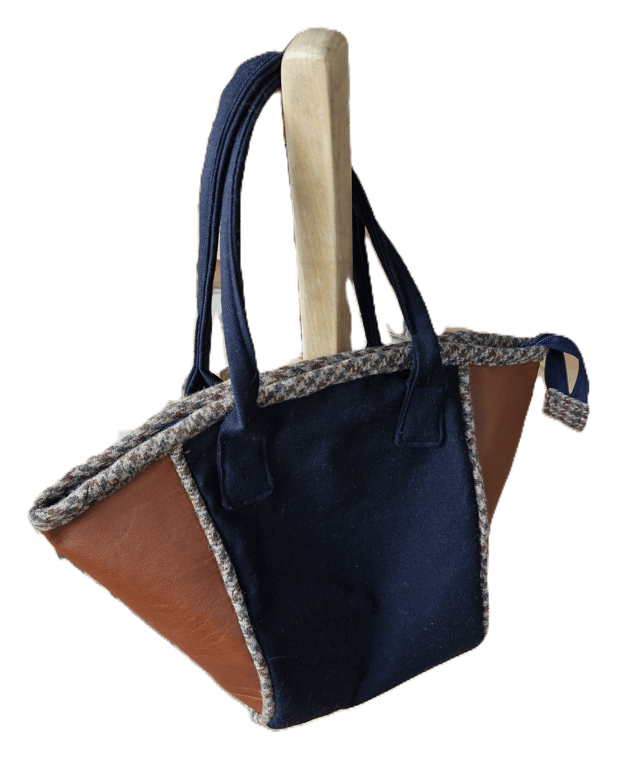 Stylish tan leather and Navy wool bucket bag with tweed piping and zip top