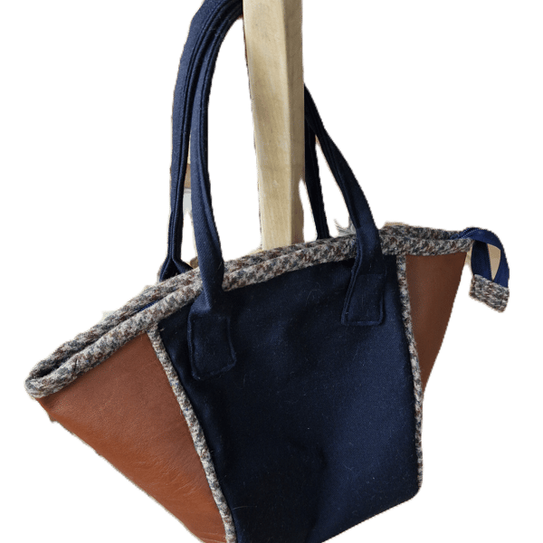 Stylish tan leather and Navy wool bucket bag with tweed piping and zip top