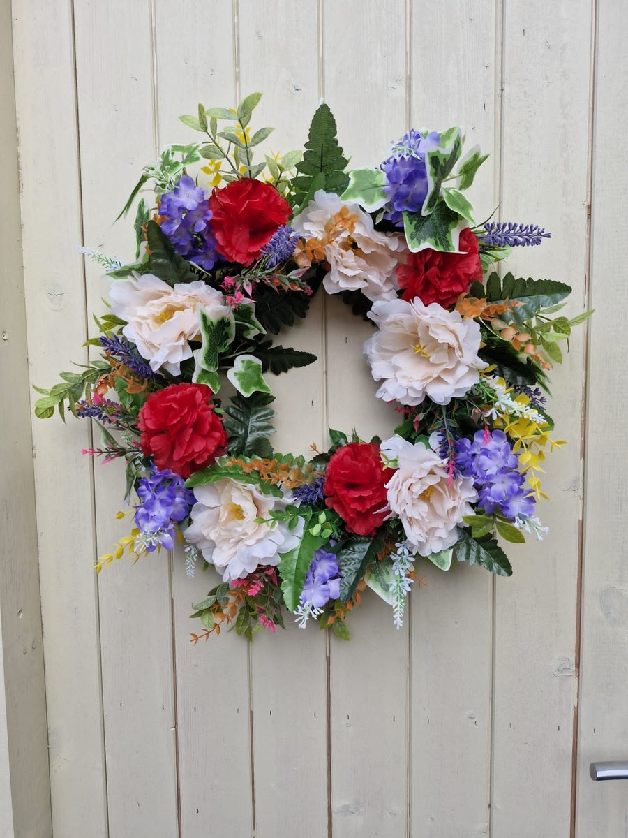RITA.   LARGE WREATH , TABLE, DOOR WALL ,GRAVE.