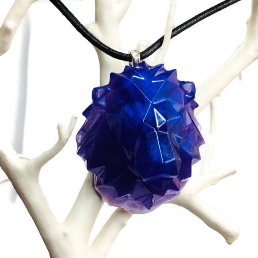 Purple lion statement pendant and black cord necklace.