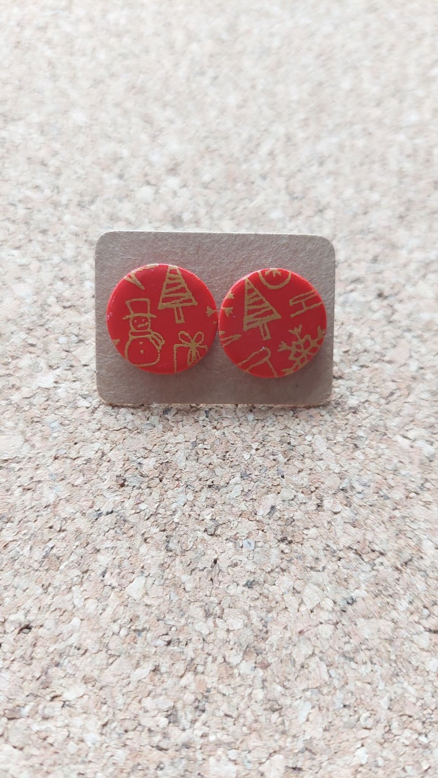 Studs with golden festive designs screen printed on