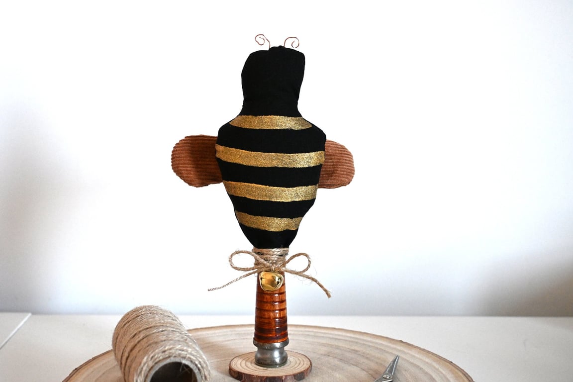 Primitive bee on stand