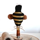 Primitive bee on stand