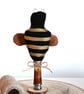 Primitive bee on stand